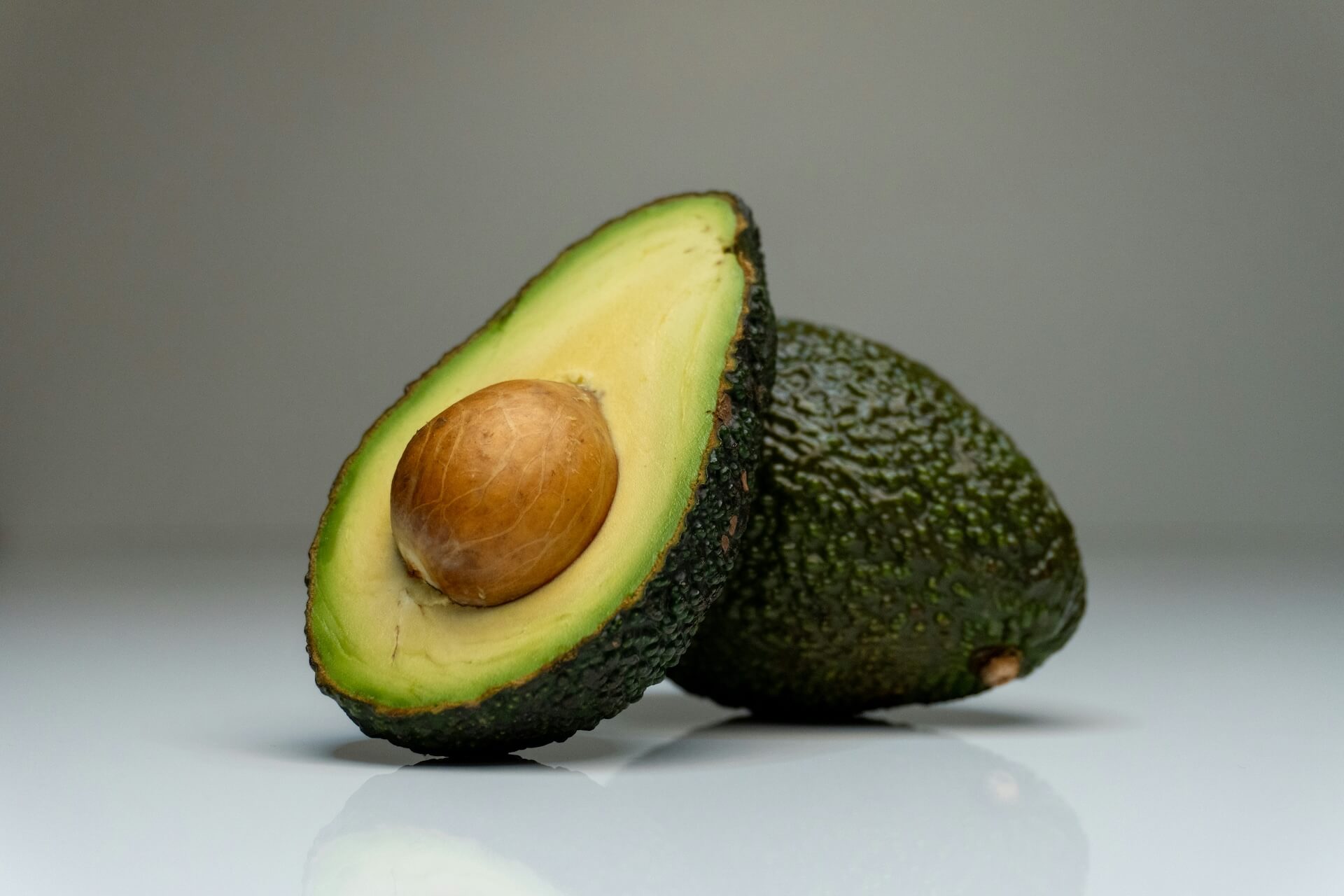 Halved ripe avocado