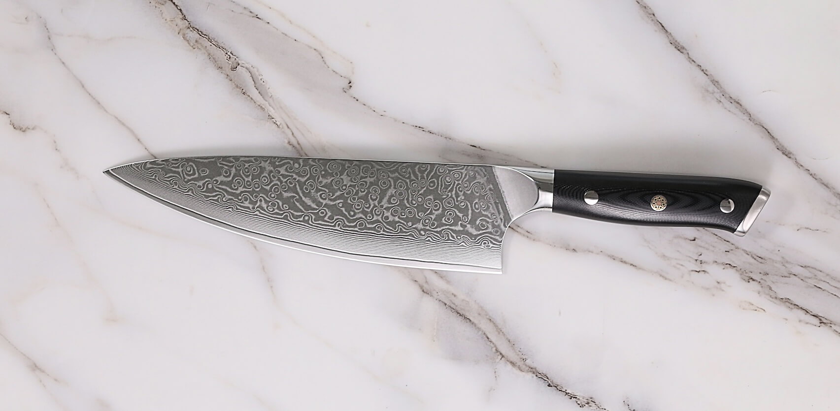 Chef's knife on marble surface