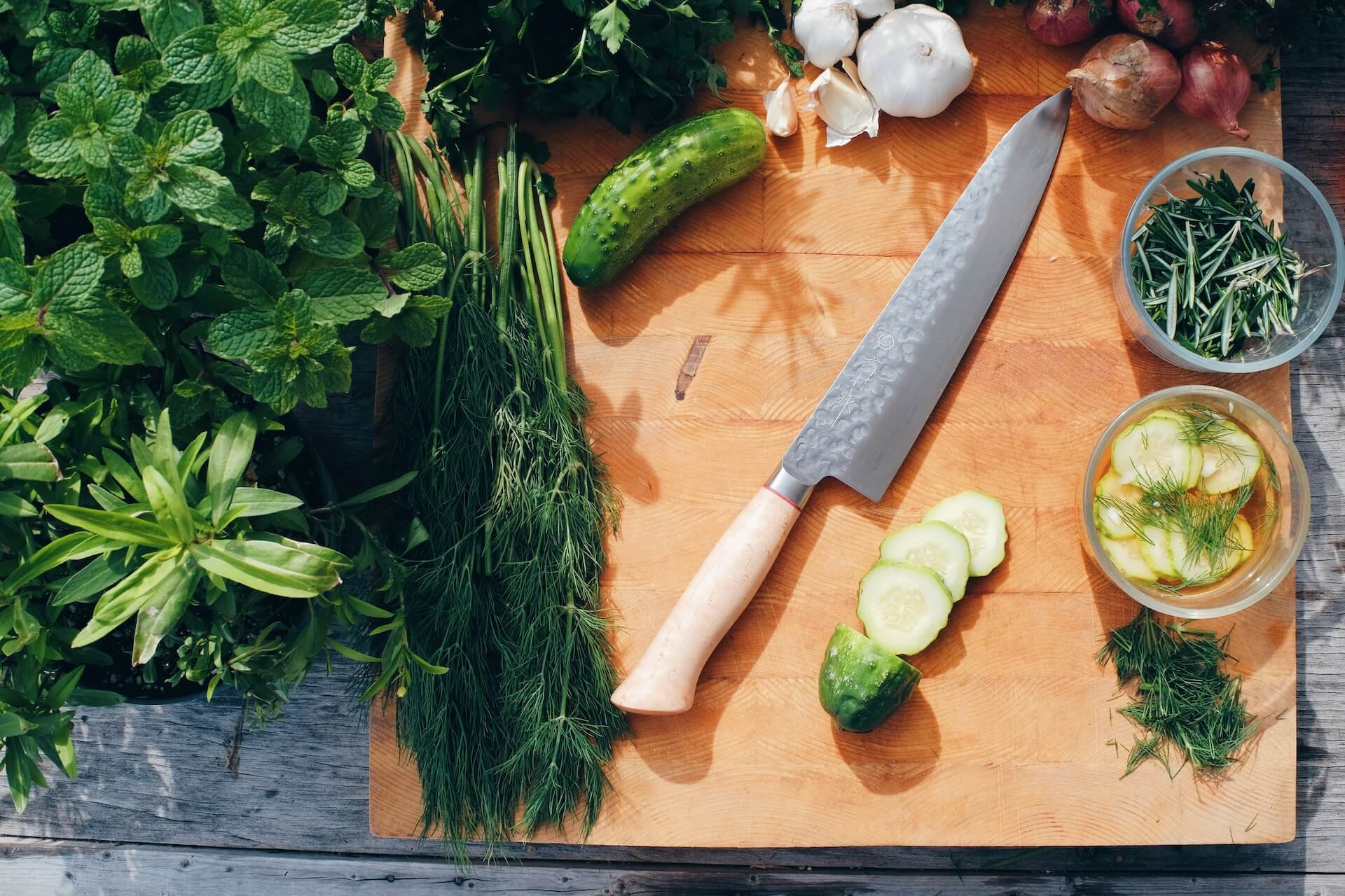 Chefs knife on wooden cutting board